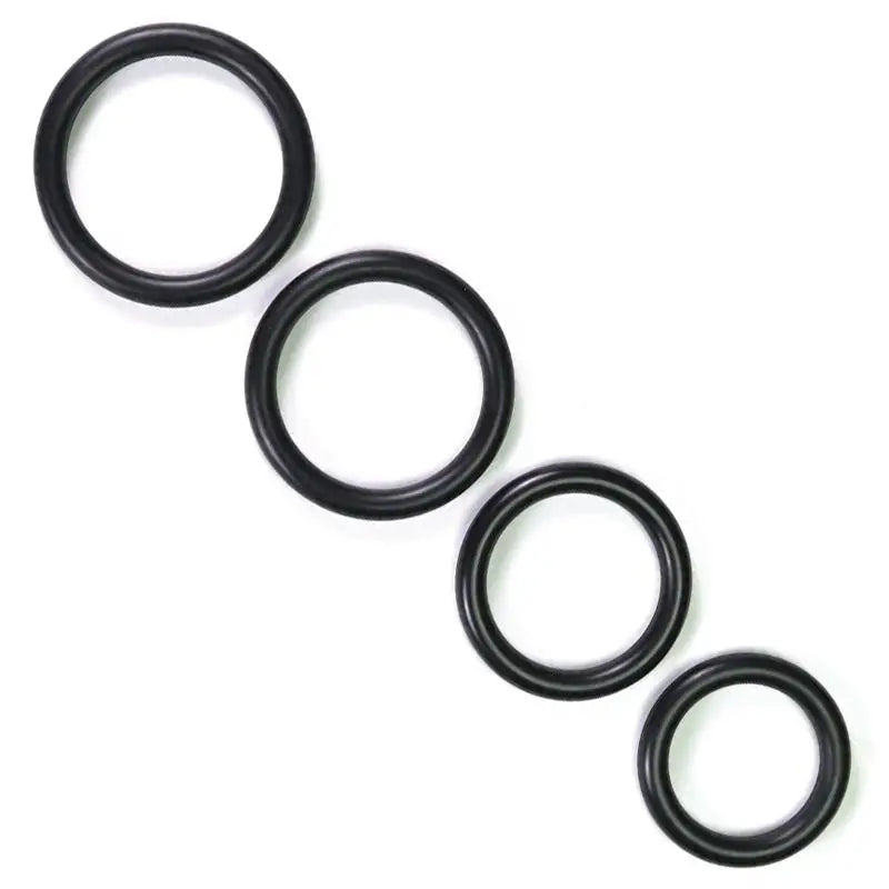 Black 4 - piece Set Of Stretchy Rubber Cock Love Rings For Men - Peaches and Screams